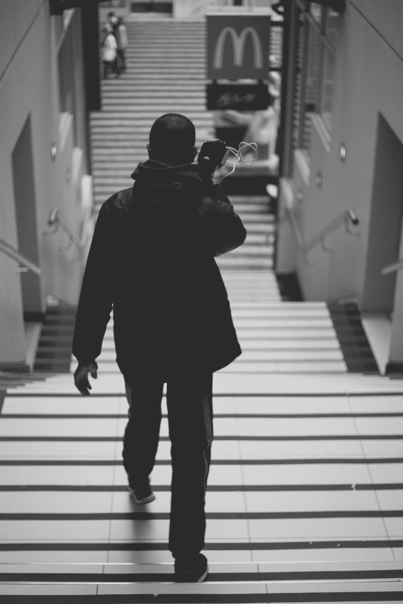 2021-12-19 - Rosebank, Johannesburg - Man walking down stairs
